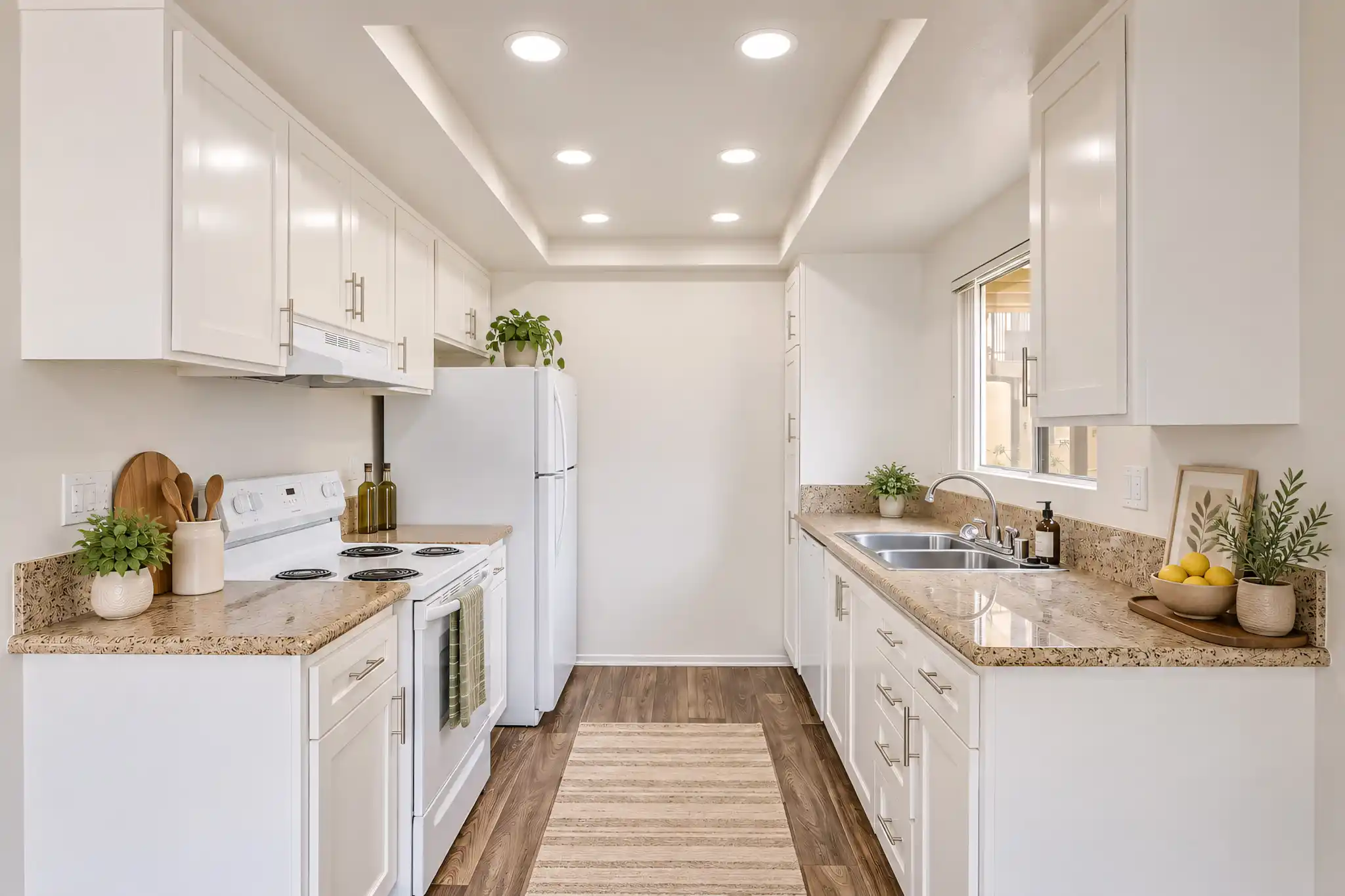 Arbor Park Apartments renovated galley kitchen with granite countertops