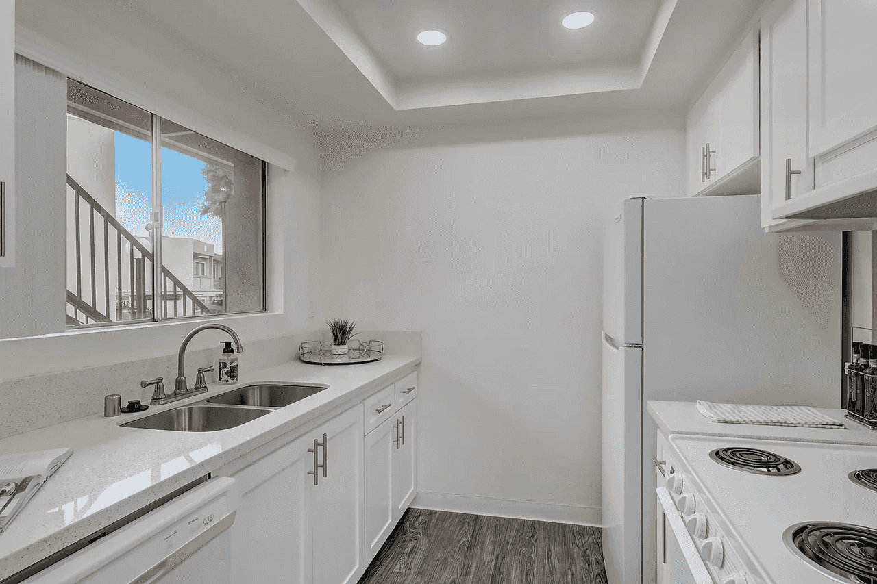 Arbor Park Apartments updated kitchen layout with white cabinetry