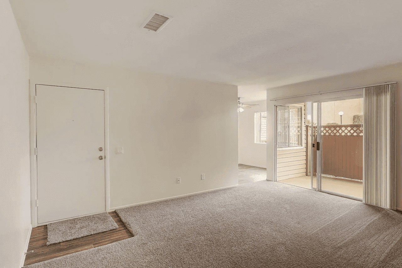spacious living room with sliding glass patio door
